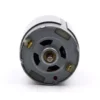 Rear housing cap of an electric vibrating motor with low-resistance solder tabs