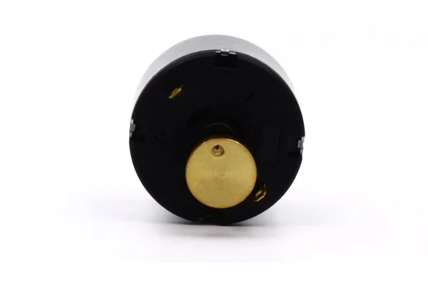 dual shaft erm vibration motor back cap Rear insulating end cap of a dual shaft ERM vibration motor showcasing soldering terminals