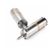 high torque micro planetary gear motor structure Top-down angle view of two micro planetary geared electric motors showing the mounting holes on the front faceplate and the dual ball-bearing output shaft