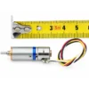 10mm mini geared stepper motor measured against a yellow tape measure showing compact length