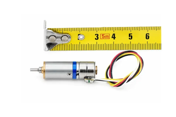 10mm mini geared stepper motor measured against a yellow tape measure showing compact length