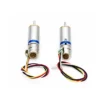 Rear view of two 10mm mini geared stepper motors displaying end caps and soldered wiring
