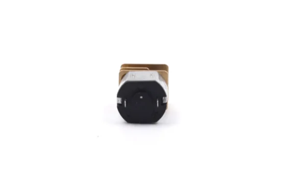 Rear view of N10 gear motor black end cap showing two power soldering terminals